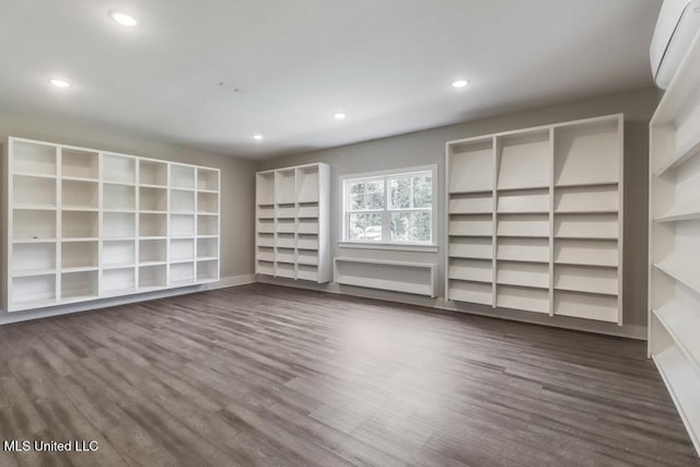 16043 W Dedeaux Rd, Gulfport, MS 39503 - unfurnished room with a wall mounted AC, recessed lighting, and dark wood-style flooring