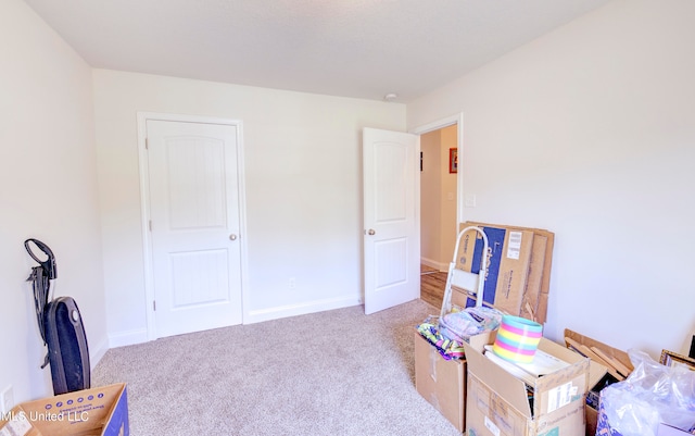 misc room featuring light colored carpet