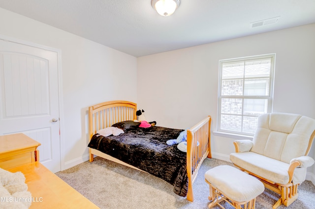 bedroom with light carpet