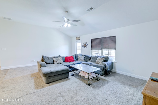 living room featuring lofted ceiling, carpet, and ceiling fan