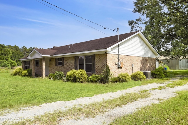 7520 Ogborn Dr, Moss Point, MS 39562 - view of property exterior featuring brick siding and central AC