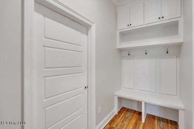 mudroom with light hardwood / wood-style floors