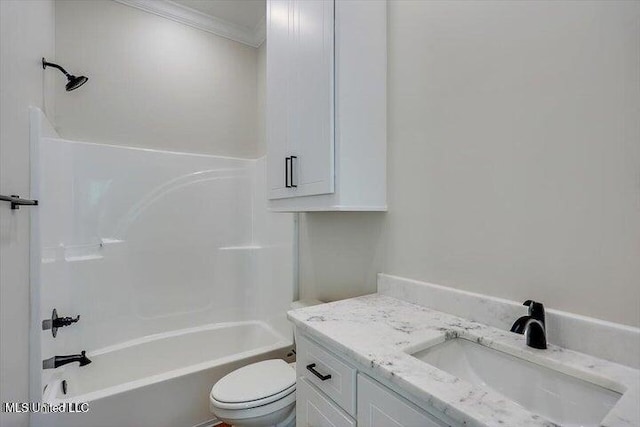 full bathroom featuring toilet, vanity, ornamental molding, and shower / bathtub combination