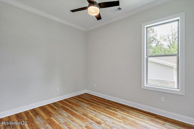 unfurnished room featuring ornamental molding, ceiling fan, and light hardwood / wood-style floors