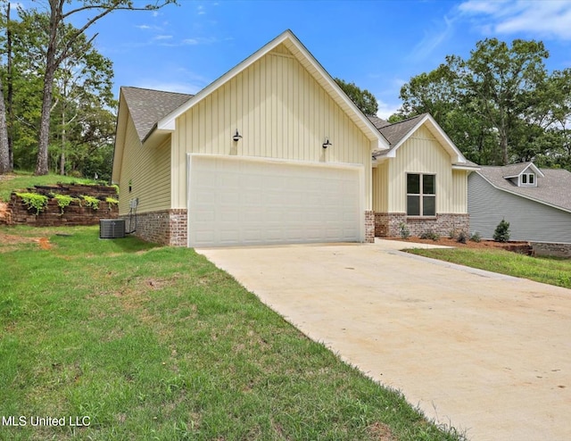 view of front of property with a garage and a front lawn