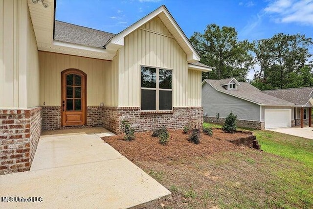 entrance to property featuring a garage