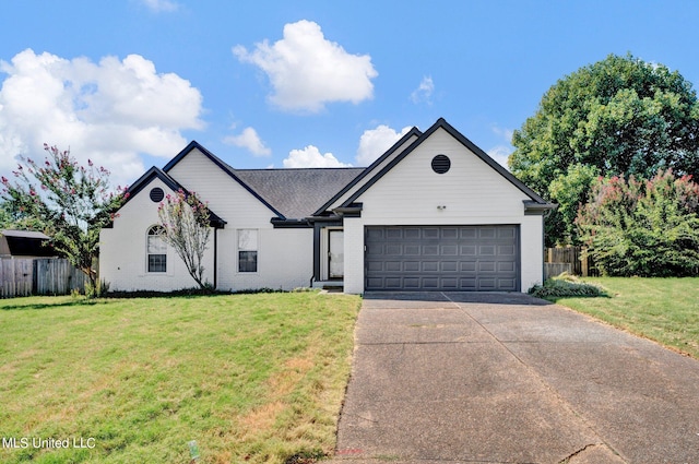 view of front of house featuring a front lawn and a garage