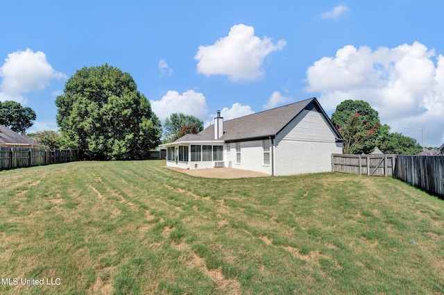 view of yard featuring a sunroom