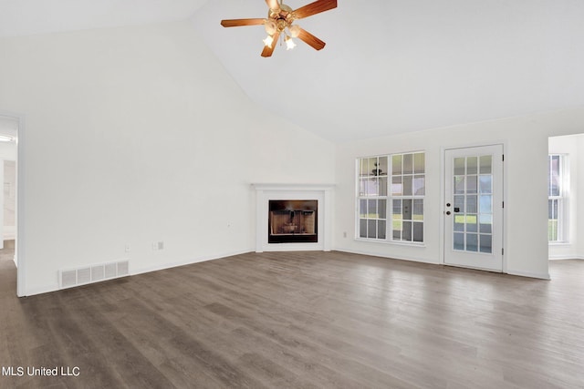 unfurnished living room featuring ceiling fan, high vaulted ceiling, and dark hardwood / wood-style flooring