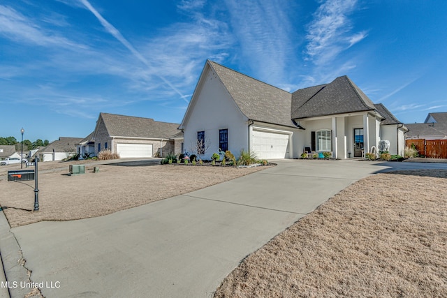 french provincial home with a garage