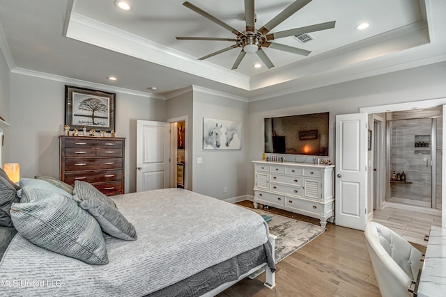 bedroom with ceiling fan, ornamental molding, a raised ceiling, and light hardwood / wood-style floors