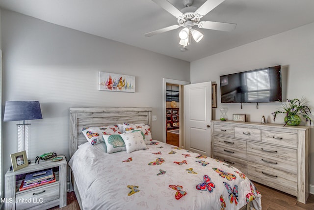 bedroom featuring dark wood-type flooring and ceiling fan