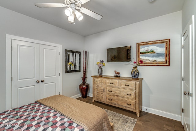 bedroom with dark hardwood / wood-style flooring, a closet, and ceiling fan