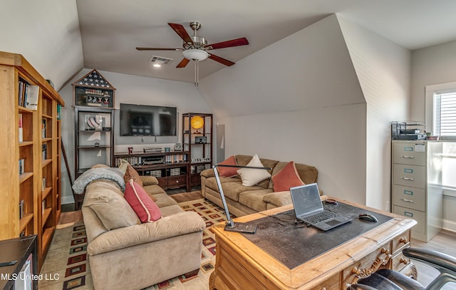 living room featuring ceiling fan, lofted ceiling, and hardwood / wood-style floors