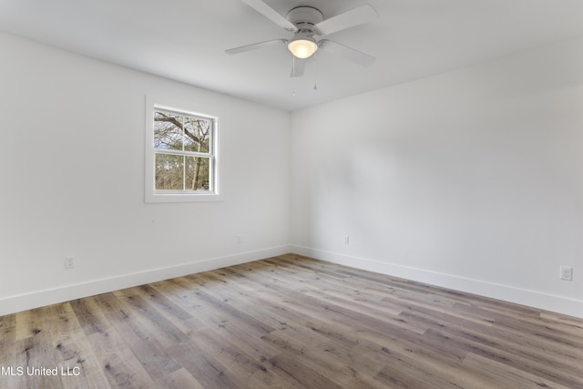 empty room featuring light hardwood / wood-style floors and ceiling fan