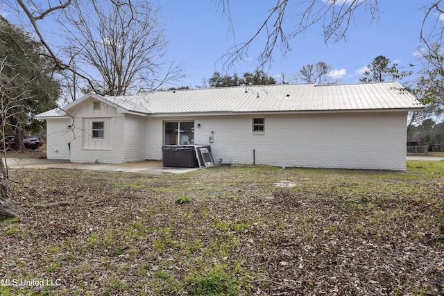 back of house with a patio