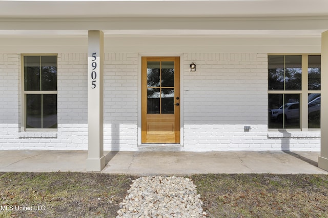 doorway to property featuring a porch