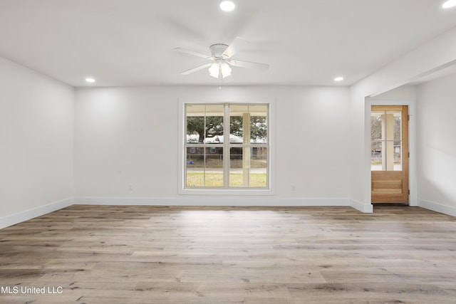 spare room with ceiling fan and light hardwood / wood-style flooring