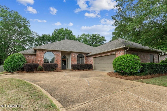 403 Chesney Ct, Madison, MS 39110 - view of front facade with a garage, brick siding, driveway, and a shingled roof