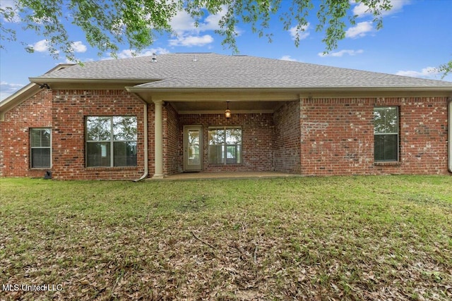 403 Chesney Ct, Madison, MS 39110 - rear view of property with brick siding, a shingled roof, and a yard