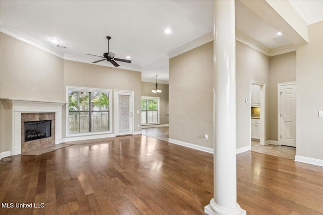 403 Chesney Ct, Madison, MS 39110 - unfurnished living room featuring ceiling fan, decorative columns, light wood finished floors, crown molding, and a fireplace