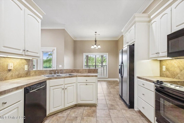 403 Chesney Ct, Madison, MS 39110 - kitchen featuring black appliances, a sink, white cabinets, healthy amount of natural light, and crown molding