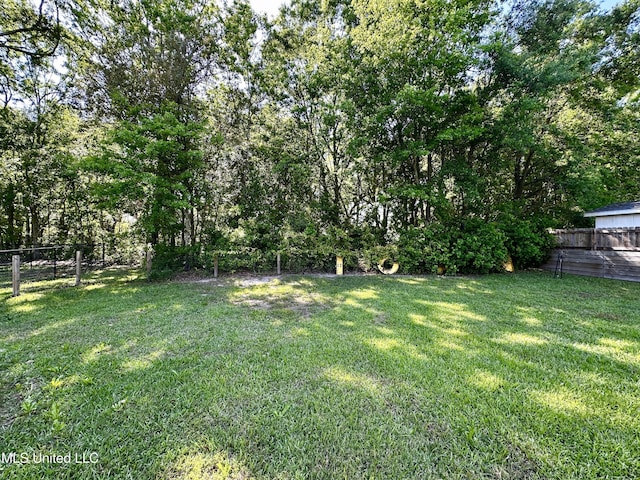 view of yard with fence