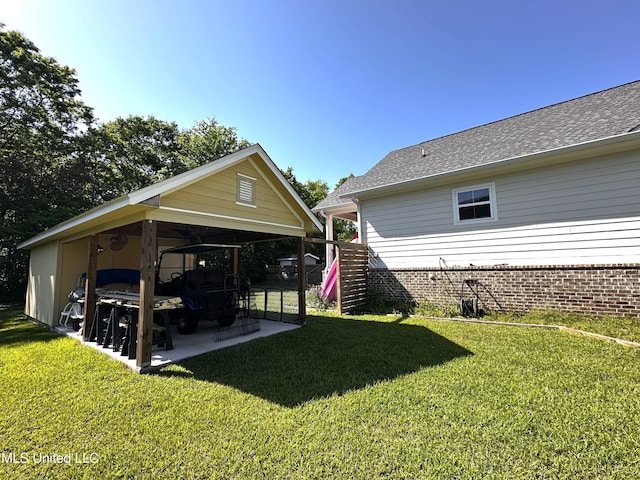 view of yard featuring a patio and a detached carport