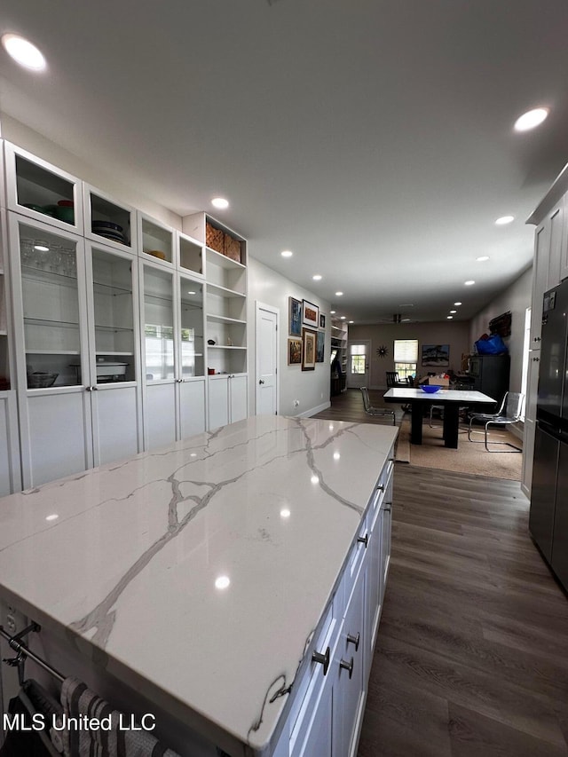 kitchen with pool table, light stone counters, recessed lighting, dark wood-style floors, and a spacious island