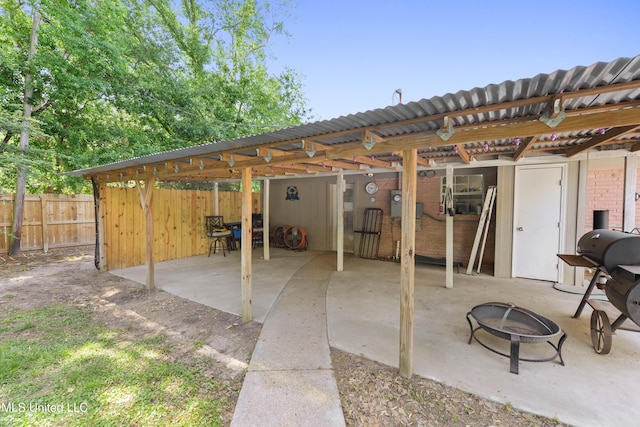 view of patio / terrace with a fire pit