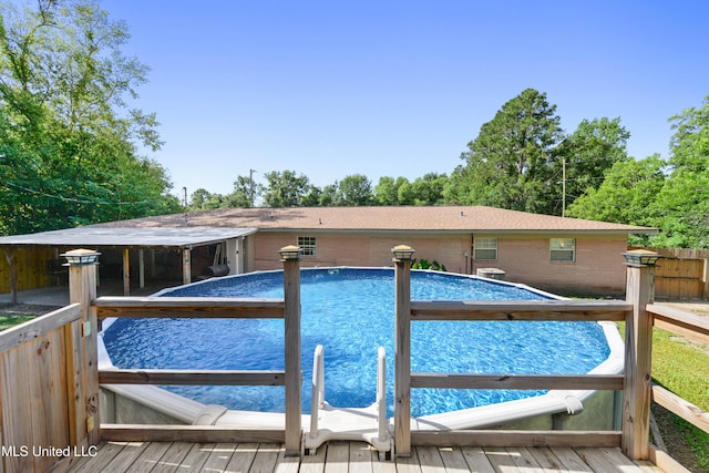 view of pool with a wooden deck