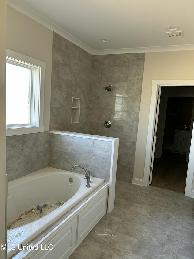 bathroom featuring visible vents, tiled shower, a garden tub, and ornamental molding