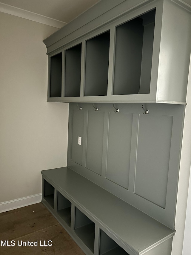 mudroom featuring baseboards and wood finished floors