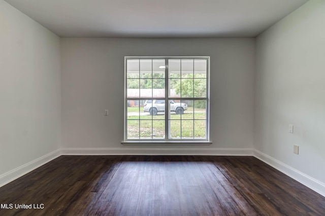 12394 Cypress Dr, Gulfport, MS 39503 - spare room with dark wood finished floors and baseboards