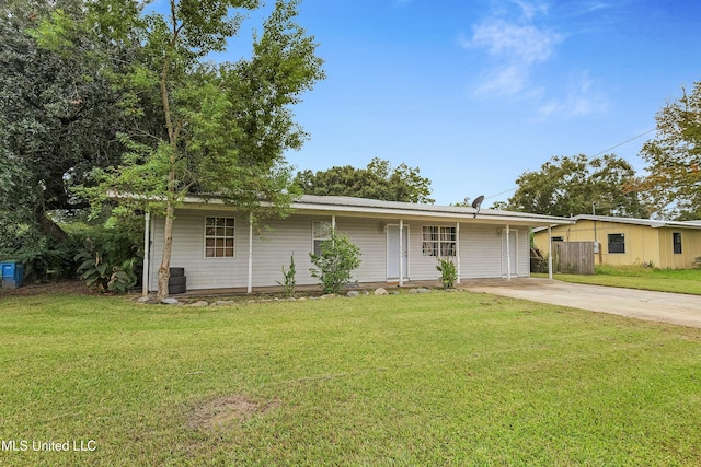 ranch-style home with a front lawn