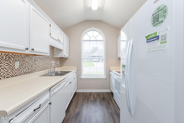 kitchen featuring white appliances, white cabinetry, dark wood-type flooring, and sink