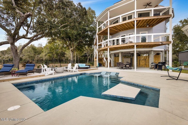 view of swimming pool featuring ceiling fan, area for grilling, and a patio