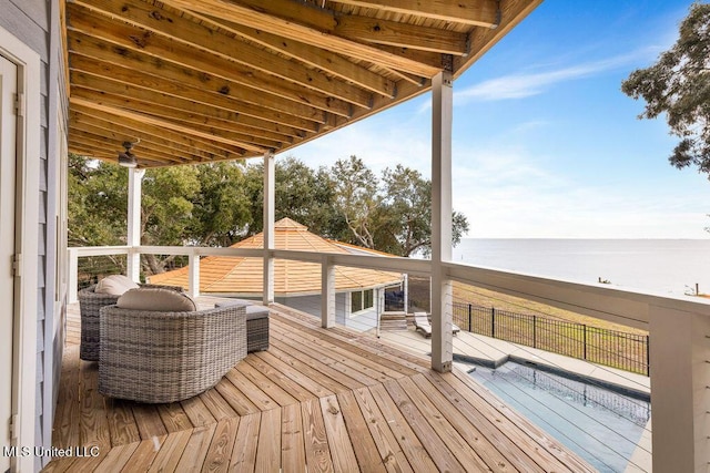 wooden deck with a water view