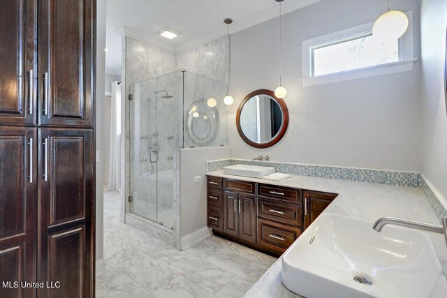 bathroom featuring vanity, a shower with door, and crown molding