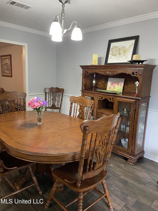 130 Eastwood Cir, Florence, MS 39073 - dining area featuring ornamental molding, a chandelier, and dark wood-style floors