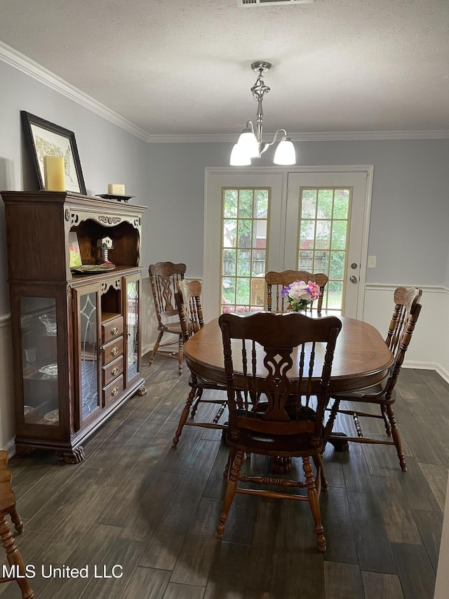 130 Eastwood Cir, Florence, MS 39073 - dining room with a chandelier, dark wood-type flooring, and crown molding