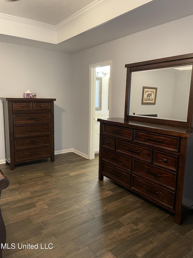 130 Eastwood Cir, Florence, MS 39073 - bedroom with crown molding, dark wood finished floors, and ensuite bath