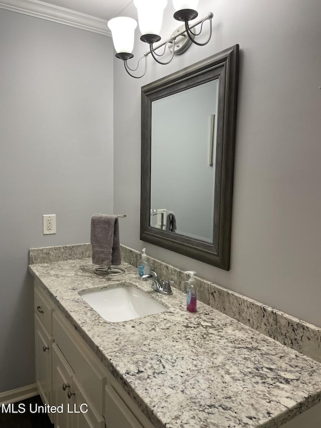 130 Eastwood Cir, Florence, MS 39073 - bathroom with vanity, a chandelier, and crown molding