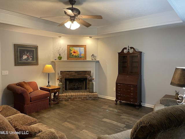 130 Eastwood Cir, Florence, MS 39073 - living area featuring ornamental molding, a ceiling fan, wood finished floors, a fireplace, and a raised ceiling