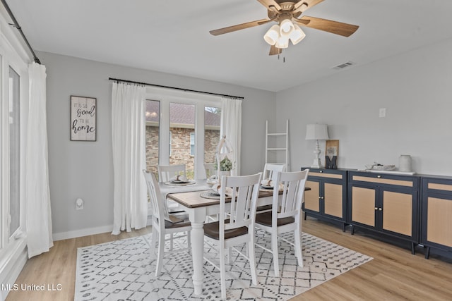 dining space featuring ceiling fan and light hardwood / wood-style floors