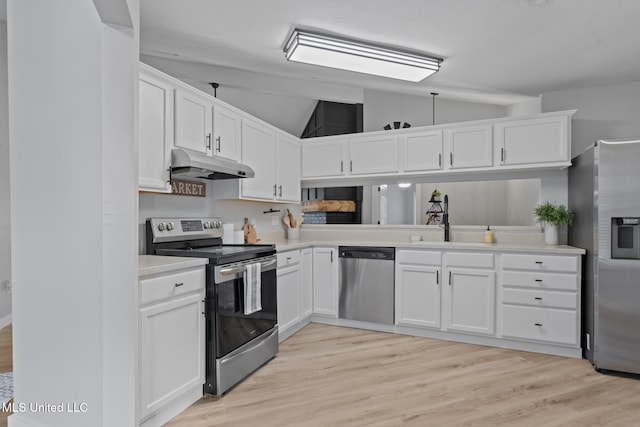 kitchen with lofted ceiling, sink, appliances with stainless steel finishes, light hardwood / wood-style floors, and white cabinets