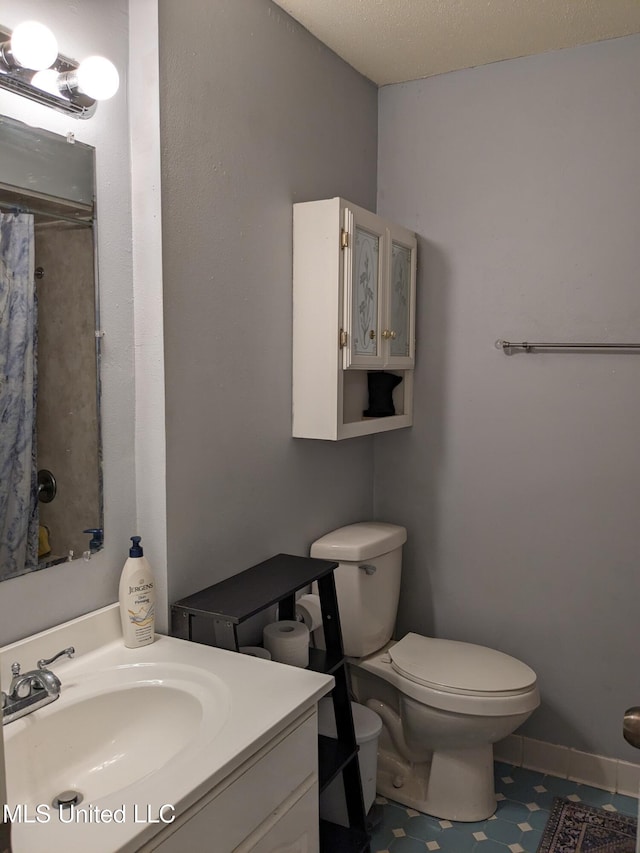 3607 Pentagon Dr, Pascagoula, MS 39581 - bathroom with vanity, toilet, and a shower with shower curtain