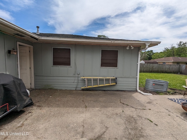 3607 Pentagon Dr, Pascagoula, MS 39581 - view of side of home featuring board and batten siding and a patio area