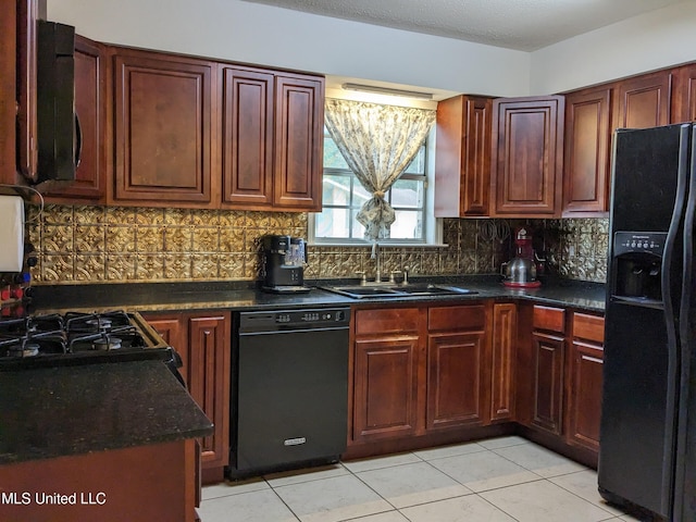 3607 Pentagon Dr, Pascagoula, MS 39581 - kitchen with black appliances, dark countertops, a sink, backsplash, and light tile patterned floors