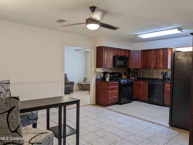 3607 Pentagon Dr, Pascagoula, MS 39581 - kitchen with black appliances, dark countertops, tasteful backsplash, light tile patterned floors, and ceiling fan